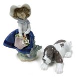 A Lladro Porcelain figure modelled as Pretty Pickings, 05222, and another of Sleepy Puppy, P4304, bo