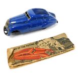 A Schuco Kommando Anno 2000 tin plate clockwork motor car, with a blue chassis. (AF)