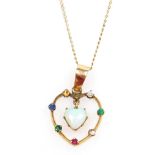 An opal and jem set "Dearest" heart shaped pendant, set in yellow metal, on a curb link neck chain,