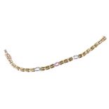 A 9ct bicolour gold bracelet, the three white metal links set with baguette cut topazes, on a snap c