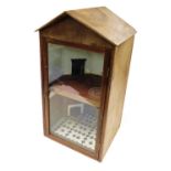 A plywood display case, formed as a two storey building of two rooms, with a glazed door, with key,