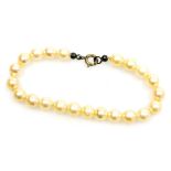 A cultured pearl bracelet, twenty two pearls of 6.5mm diameter average to bolt ring clasp, 16cm long