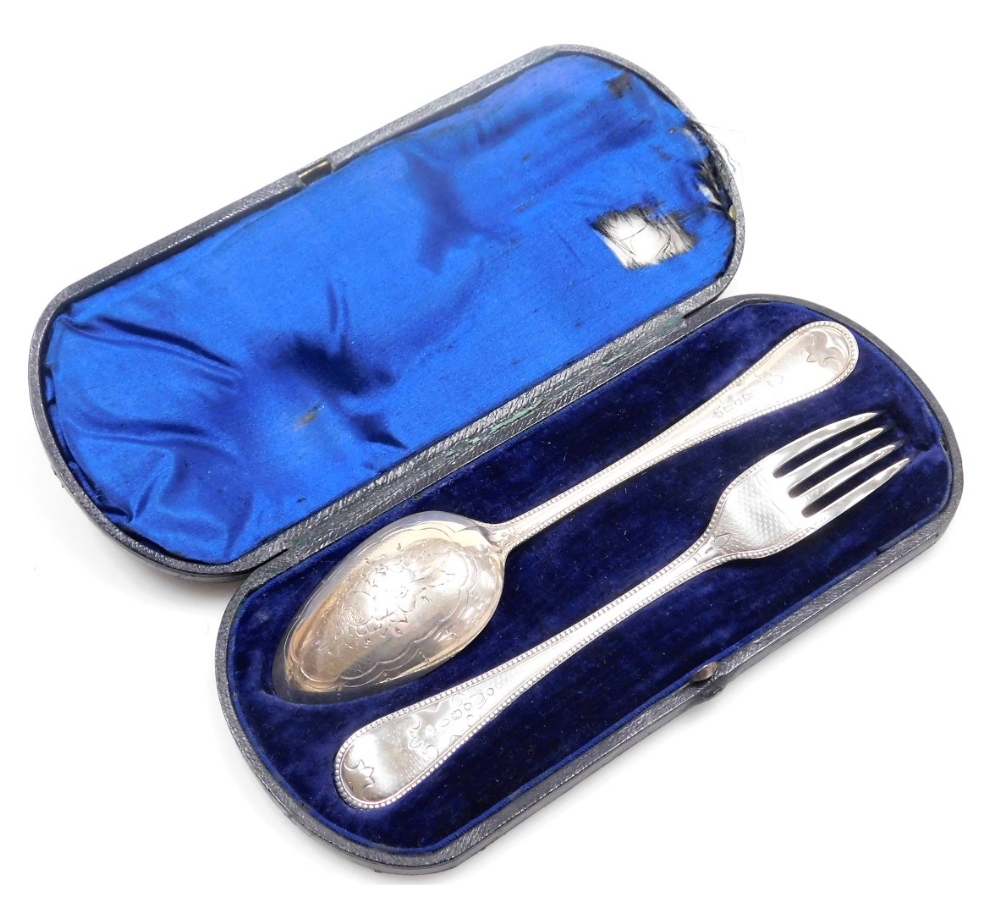 A Victorian silver fork and spoon, with engraved floral and engine turned decoration, cased, maker's