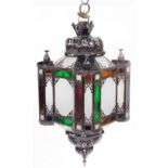 A Moroccan tin and glass hanging lantern, of mosque form, 82cm high.