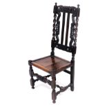 A 19thC Carolean style oak chair, with a crown and leaf scroll carved crest rail, two similarly carv