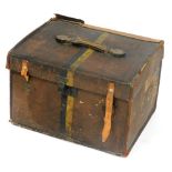 An early 20thC vintage leather trunk, bearing travel labels and initials FB, 34cm high, 52cm wide, 4