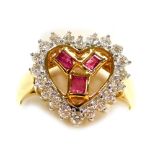 A heart shaped diamond and ruby pierced cluster ring, set in a hand carved precious yellow metal mou