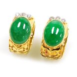 A pair of jade and diamond set hoop earrings, cabachon jade stones of 12mm x 9.5mm average, topped b