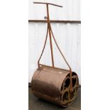 A garden roller, and an Aviary fifty-six pound weight. (2)