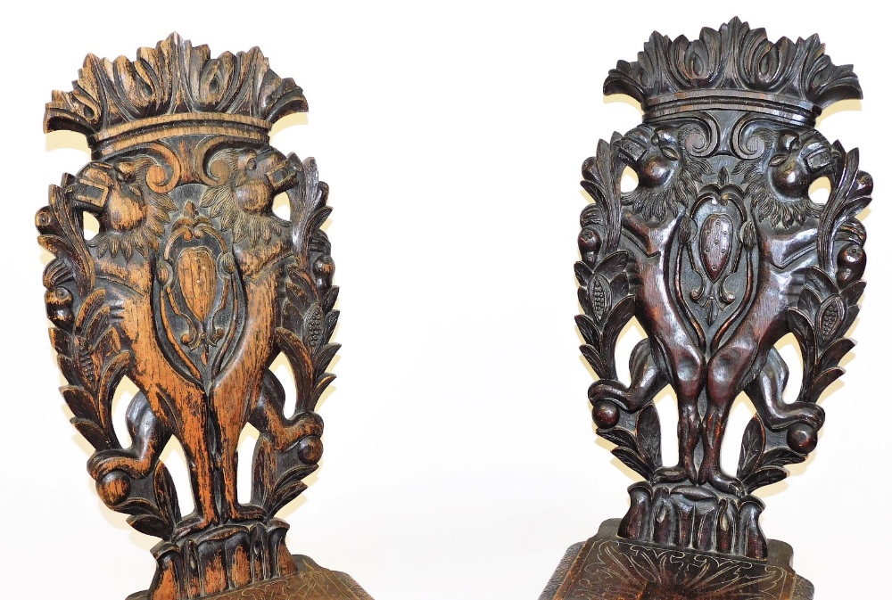 A pair of early 19thC Italian oak Sgabello hall chairs, with foliate carved crest rails, the back ca - Image 2 of 3