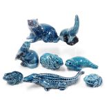 Eight Poole blue glazed pottery figures of animals and reptiles, including a crocodile, seals, and a