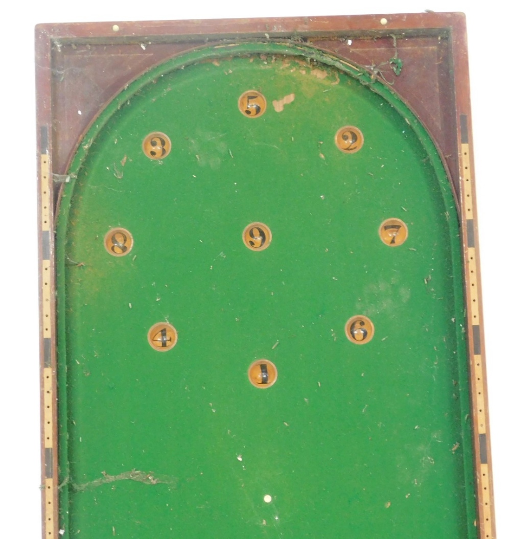 An early 20thC stained mahogany table top bagatelle, with a green baize interior, 123cm high, 115cm - Image 2 of 3