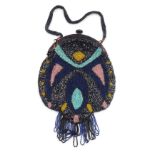 An early 20thC beaded lady's evening purse, with abstract pattern in yellow turquoise, pink, black,