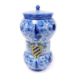 A Deruta pottery alborello, of waisted cylindrical form decorated centrally with a coat of arms and