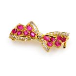 A ruby and diamond set bow brooch, set with twelve rubies of 2mm average with accents of tiny diamon