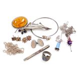 A group of silver jewellery, including a Ylang Ylang daisy bangle and pair of earrings, a holly and
