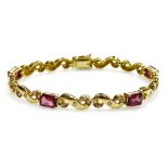 A tourmaline and diamond set articulated bracelet, five rectangular faceted stones of 7.3mm x 5mm av