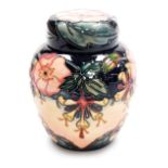 A Moorcroft pottery Oberon pattern ginger jar and cover, impressed marks and signed to underside, 16