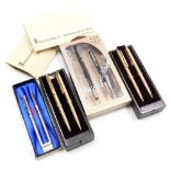 A group of ballpoint pens, to include a two case set of Papermate pens in brushed gold coloured casi