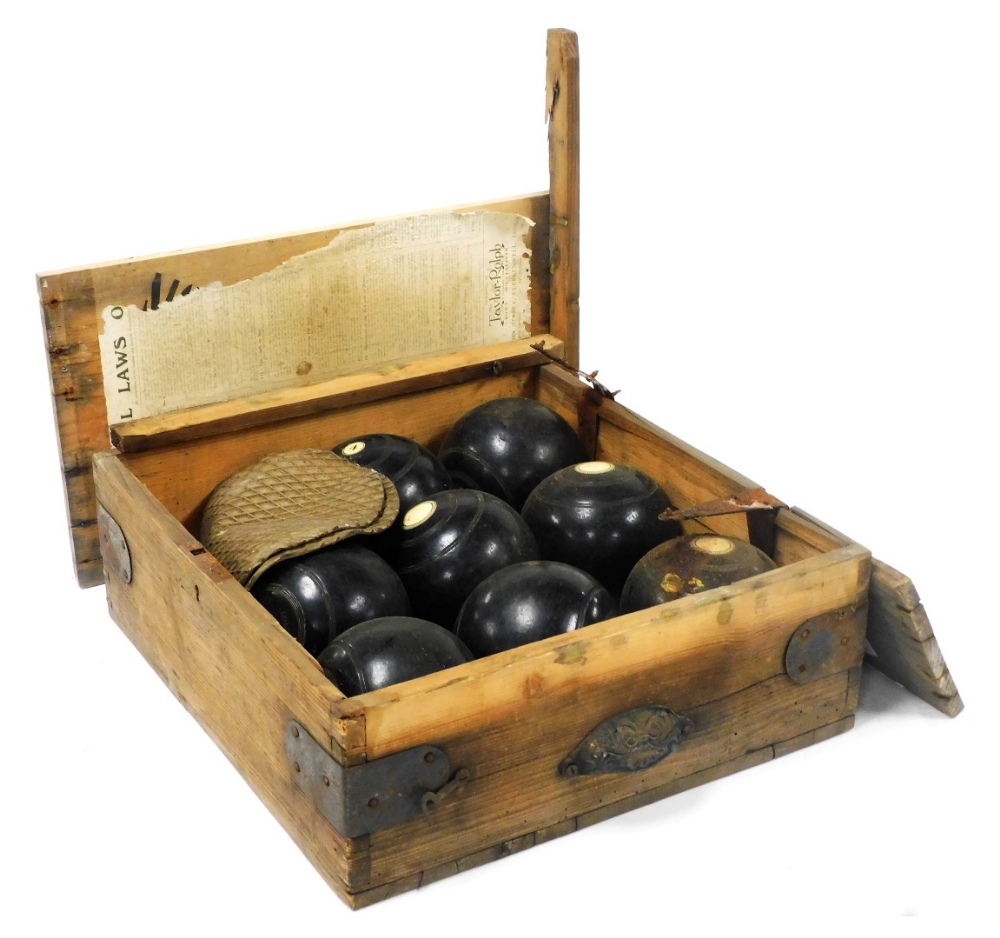 A set of eight Taylor Rolph Co Ltd lawn bowls, two further white balls, contained in a wooden case