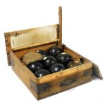 A set of eight Taylor Rolph Co Ltd lawn bowls, two further white balls, contained in a wooden case