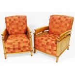 A pair of pale beech framed and cane armchairs, with red chequered loose cushions, raised on outswep