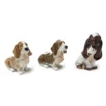 A pair of Royal Copenhagen porcelain figures of Basset Hounds, number 356, together with a Dahl Jens