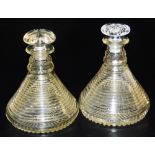 A pair of 19thC cut glass ship's decanters, of banded form, with stoppers, 22cm high.