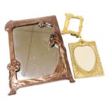 An Art Nouveau style bronzed plaster strut photograph frame, strut lacking, 36cm high, together with