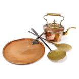 A copper lid with a cast iron handle, stamped VR, a copper and brass kettle, 38cm wide, and brass sk