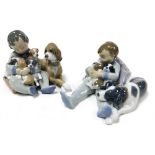A Lladro Porcelain figure group of a seated boy on a cushion, holding four puppies with a dog beside