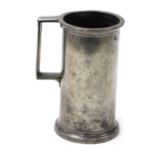A 19thC pewter tankard, with a protruding rim, bearing various stamps, on a stepped base, stamped to