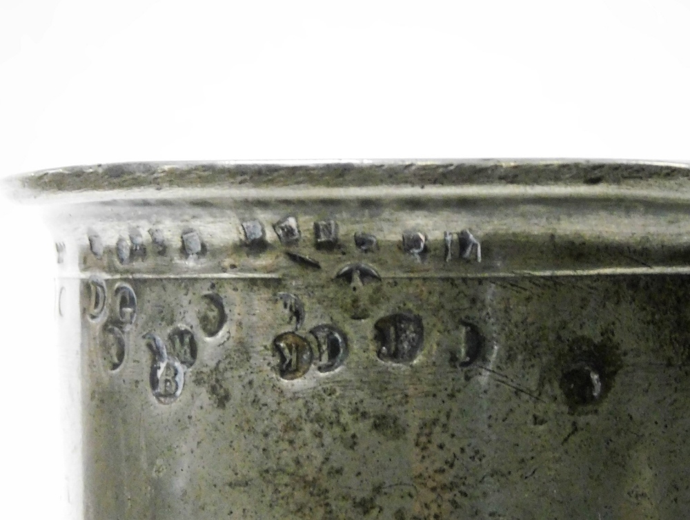 A 19thC pewter tankard, with a protruding rim, bearing various stamps, on a stepped base, stamped to - Image 2 of 3