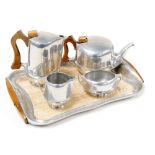 A Picquot ware five piece teaset, comprising a twin handled tray, teapot, hot water jug, cream jug a