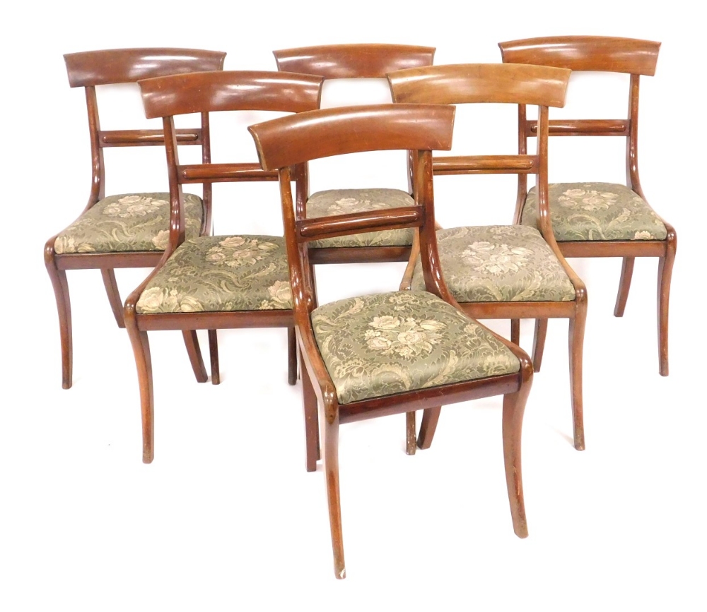 A set of six late Victorian bar back single dining chairs, with drop in seats, raised on sabre legs.