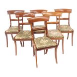 A set of six late Victorian bar back single dining chairs, with drop in seats, raised on sabre legs.