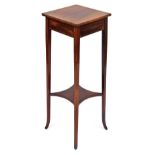 An Edwardian mahogany and cross banded jardiniere stand, raised on square slender tapering outswept