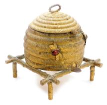 A 19thC gilt metal sewing box in the form of bee skep, with a hinged lid and twisted top handle, the