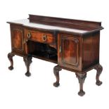 A Waring and Gillow mahogany sideboard, with a bow fronted central drawer flanked by a pair of cupbo