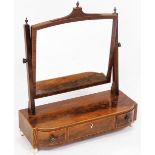 A George III flame mahogany swing frame toilet mirror, with rosewood crossbanding and boxwood line i