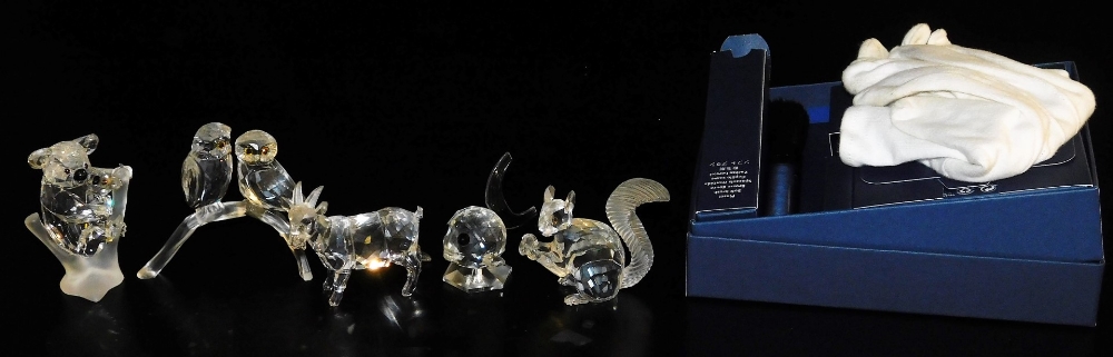 Six Swarovski crystal figures, boxed, comprising a koala bear, two owls on a perch, a fish, squirrel