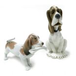 A Lladro Porcelain figure of a Basset Hound, modelled standing with a newspaper in its mouth, togeth