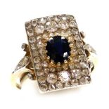 An Art Deco sapphire and diamond ring, set with an oval cut sapphire, rose and old cut diamonds in a