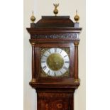A Georgian oak longcase clock by Manister Baxter of St Neots, the square brass dial with rococo styl