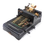 An early 20thC Burroughs adding machine, in black casing, 27cm high.