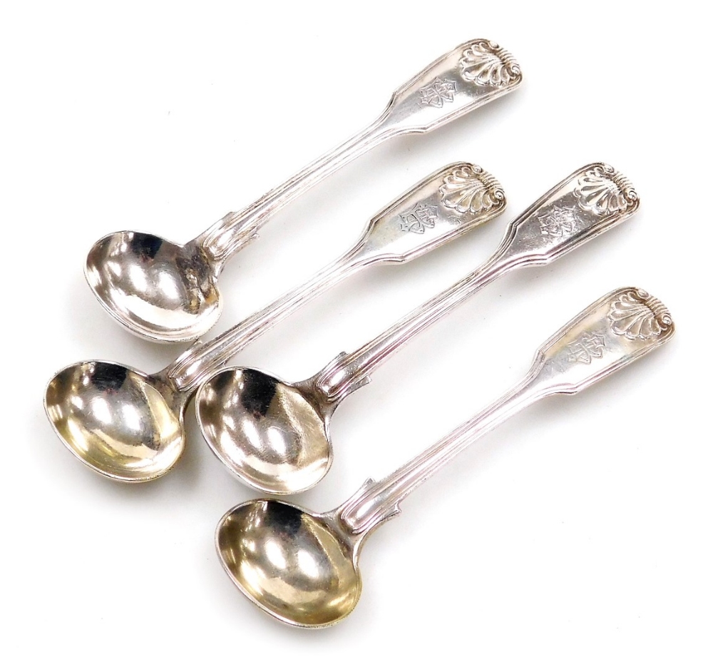 Four Victorian silver Fiddle pattern mustard spoons, each monogram engraved with shell decoration to