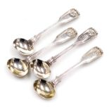 Four Victorian silver Fiddle pattern mustard spoons, each monogram engraved with shell decoration to