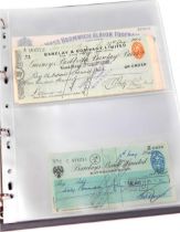 An album of English, Scottish and Irish cheques, including Gurneys, Barclays, and Midland branches,