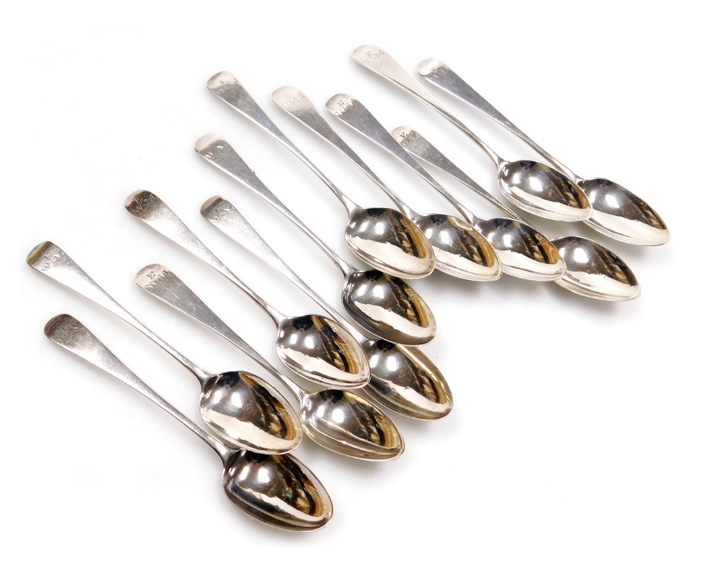 A matched set of George III silver Old English pattern teaspoons, each monogram engraved, assay mark