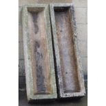 A pair of composition planters or troughs, each of rectangular form, 190cm x 34cm.